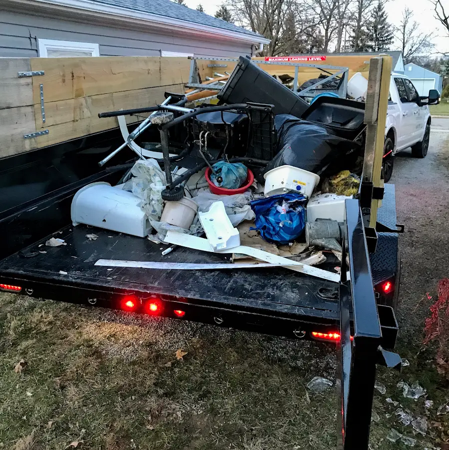Roll-off dumpster delivered to a residential driveway in Liberty Triangle